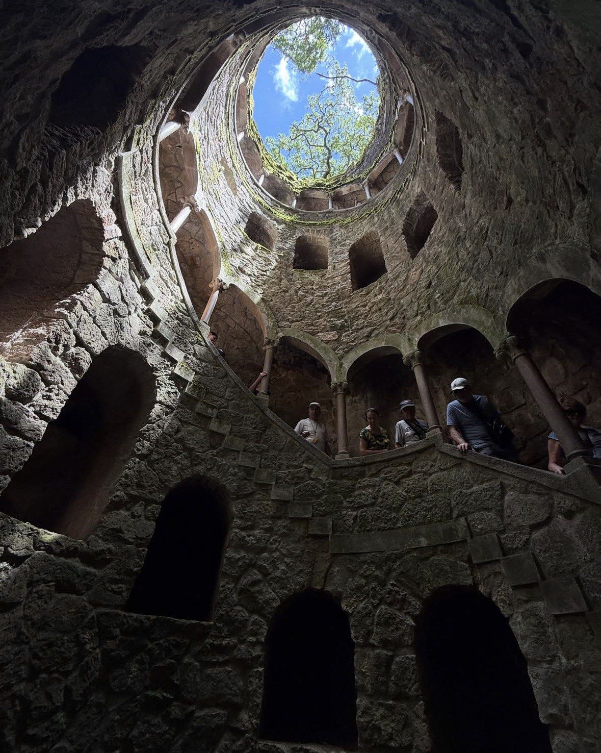 Walkers on the Initiation Well ramp seen against the open sky